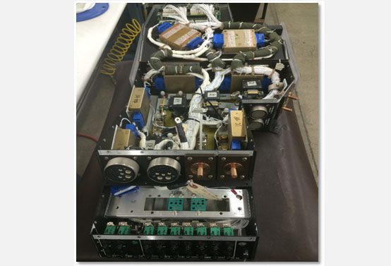 Custom-built electronic device with multiple circuit boards and components.