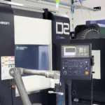 Industrial CNC machine in a manufacturing setting.