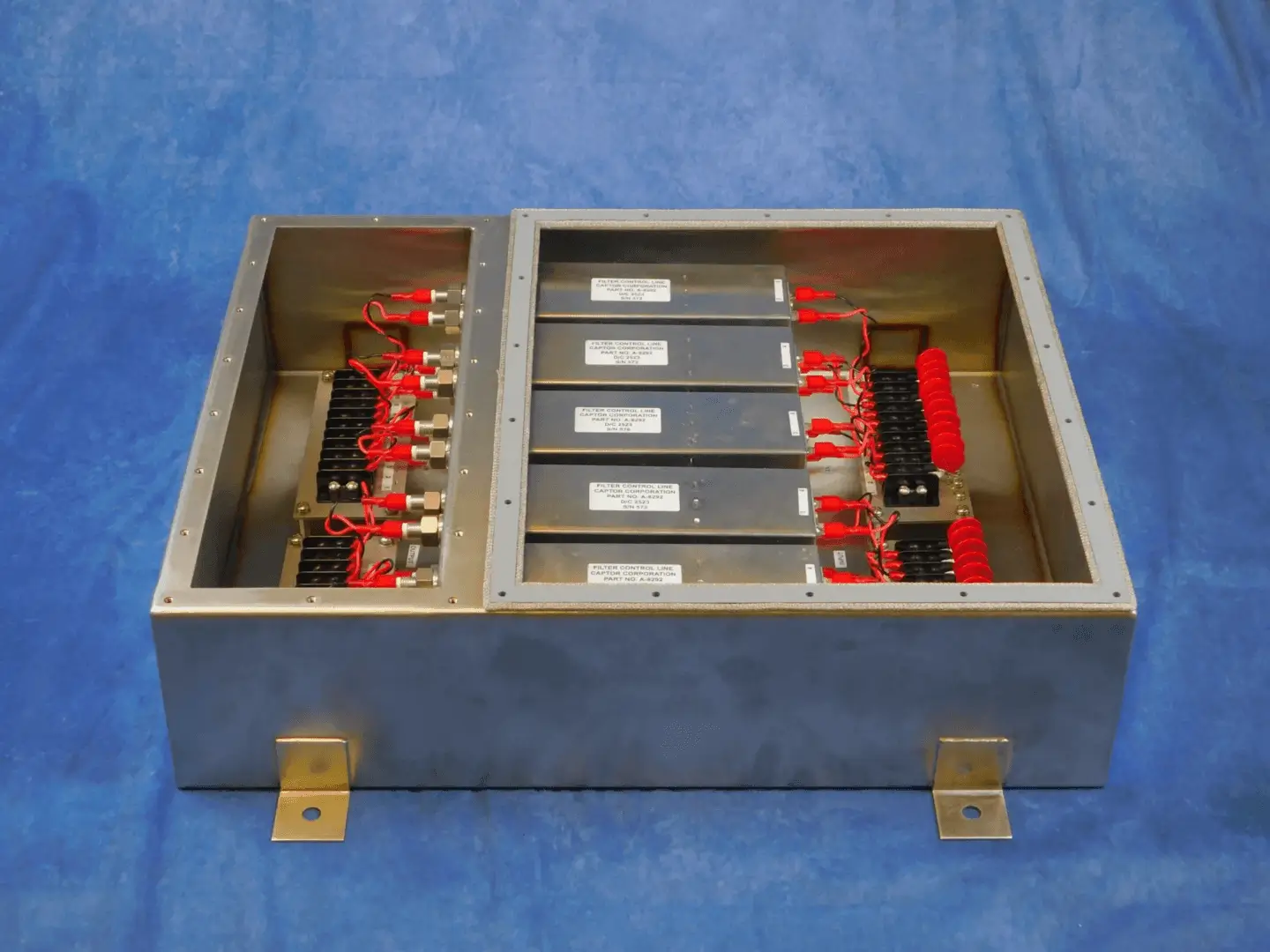 Open stainless box showing filter modules and connectors